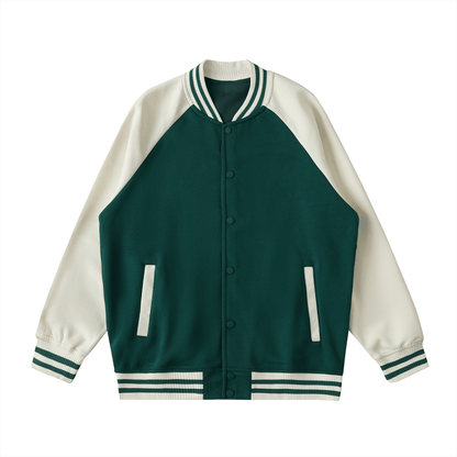 Two tone raglan sleeve varsity jacket with button-up front and striped ribbed cuffs in green and cream colors