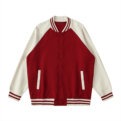 Two-tone raglan sleeve varsity jacket in red and white with button-up front and striped cuffs