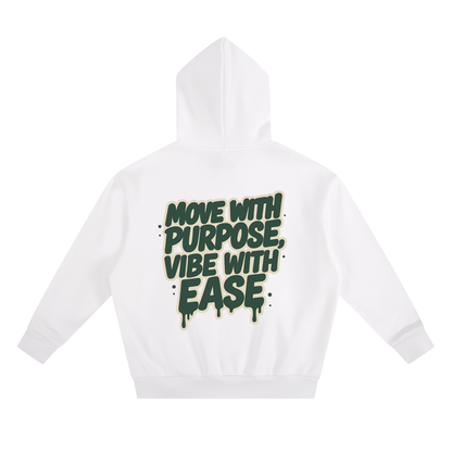 White oversized cropped hoodie with "Move with Purpose, Vibe with Ease" green text print on back, cotton-poly blend streetwear design.