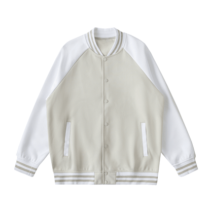 Two tone raglan sleeve varsity jacket with beige body and white sleeves, button-up front, relaxed fit, and striped cuffs.