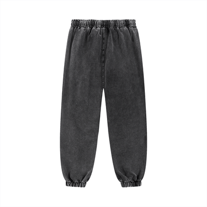 Black snow wash jogged sweatpants with elastic waist and cuffs, casual oversized fit for streetwear and comfort