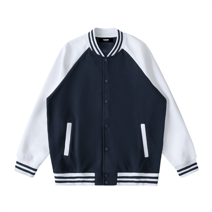 Two tone raglan sleeve varsity jacket with button-up front and striped cuffs and collar