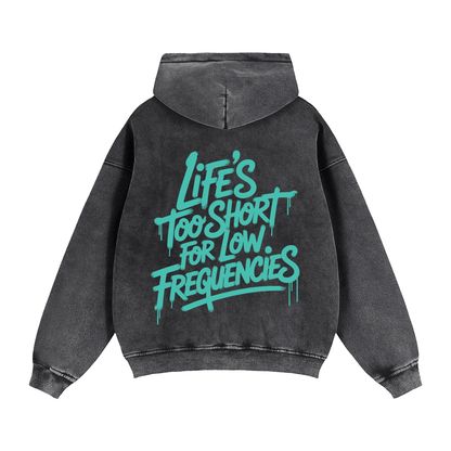 Black Zip-Through Boxy Fleece Hoodie with teal "Life's Too Short for Low Frequencies" text on back, casual streetwear style