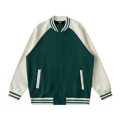 Two tone raglan sleeve varsity jacket in green and white with button-up front and striped cuffs.