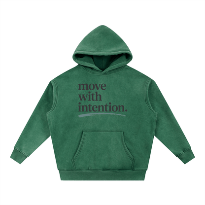 green oversized hoodie with "move with intention" text front snow wash fleece fabric