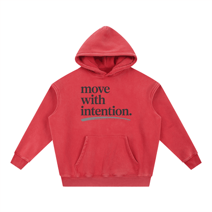 Red oversized hoodie with "move with intention." text and front pocket, snow wash fleece fabric, unisex streetwear style