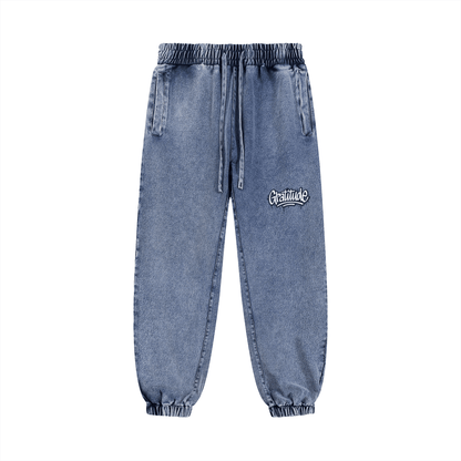 Unisex blue Gratitude Snow Wash Jogged Sweatpants with elastic waist and cuffs, casual streetwear cotton blend pants