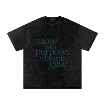 Black Snow Washed Oversized Cotton T-Shirt with "move with purpose, vibe with ease" text design, soft breathable fabric, loose fit, round neck, short sleeves.