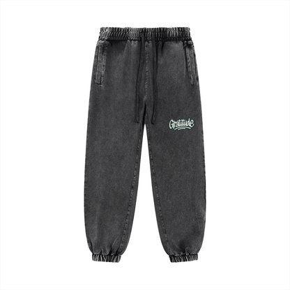 Unisex snow wash jogged sweatpants with elastic waist and pockets in dark gray cotton blend fabric