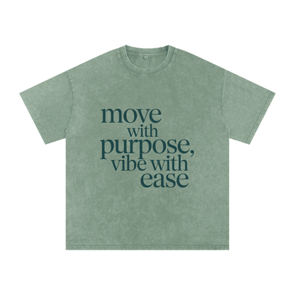 Snow washed oversized cotton t-shirt in green with "move with purpose, vibe with ease" text, soft breathable fabric, casual loose fit, short sleeves, round neck.