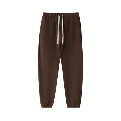 Brown heavyweight cotton sweatpants with drawstring waistband and elastic cuffs, cozy streetwear joggers.