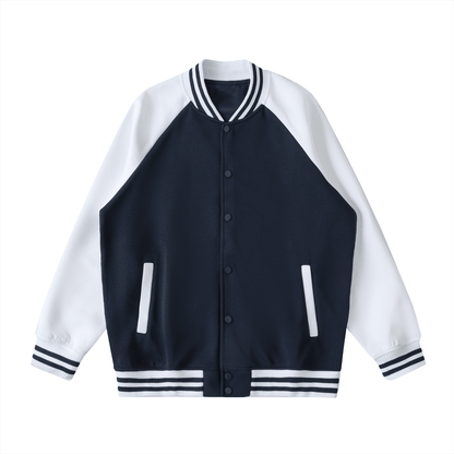 Unisex two tone raglan sleeve varsity jacket with button-up front, navy body, white sleeves, and striped cuffs and collar