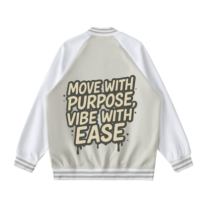 Two tone raglan sleeve varsity jacket with graphic text "Move with purpose, vibe with ease" on back